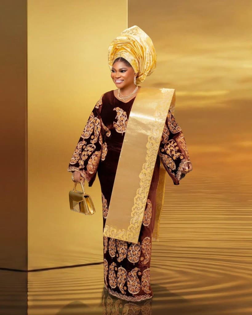 Wearables by Ashabi embroidered occasionwear styled with a gold gele and shoulder sash